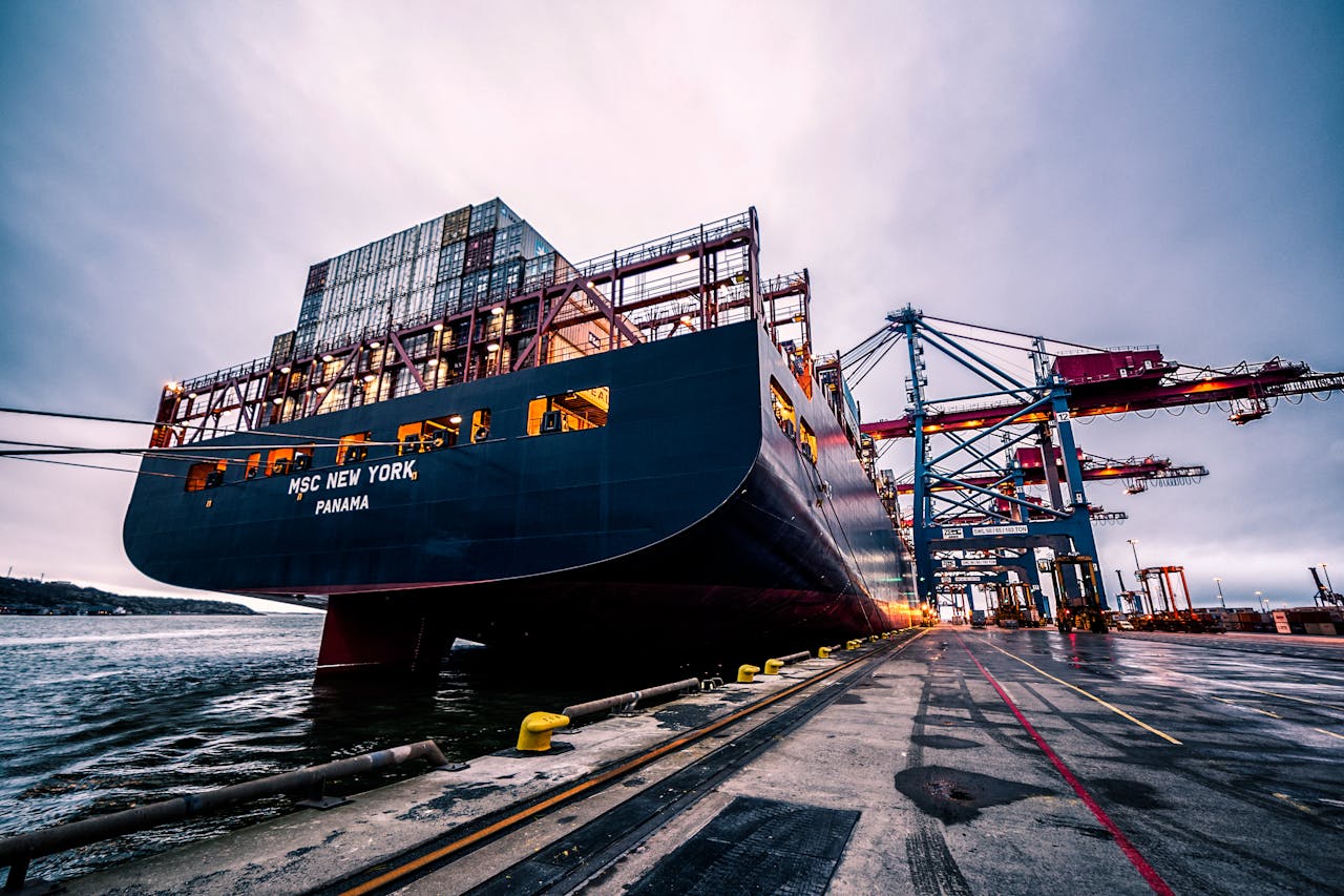 creative-03 A large cargo ship docked at Gothenburg port with industrial cranes, Sweden.